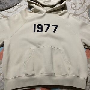 Essentials Cream Hoodie with Black '1977' Print